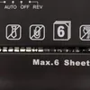 Close-up of a black shredder with white icons and text indicating its features. Produktbild-Vorschau