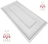 A white, textured ceiling or wall panel with a decorative embossed pattern, shown from a diagonal angle against a white background. Two logos with the text 'IKHE MALARKA' are present in opposite corners. Produktbild-Vorschau