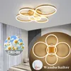 A modern living room with a ceiling light fixture and curtains. Náhled obrázku produktu