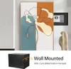 A collage showing a wall safe and a piece of abstract art, with text indicating wall mounting. Produktbild-Vorschau