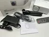 A collection of items for a mini LED projector, including the projector itself, a power adapter, a remote control, a mini tripod, and a manual. Produktbild-Vorschau