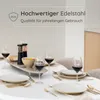 A dining table set for a meal, with place settings, wine glasses, and a centerpiece. Produktbild-Vorschau