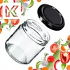 A clear glass jar with a black lid is shown, surrounded by various fresh vegetables and herbs. Anteprima dell’immagine prodotto