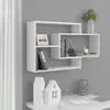 A white modular wall shelf unit mounted on a gray wall, holding books, a framed picture, and decorative items. Below the shelf, on a white desk, are two white decorative house figurines and a small pink vase. Anteprima dell’immagine prodotto