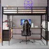 A loft bed with a desk and chair setup, featuring a computer and clothing hanging on the side. Náhled obrázku produktu