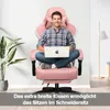 A man sitting cross-legged in a pink gaming chair while using a laptop. A plant is visible on the left. Náhľad obrázku produktu