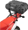A black Kriega drypack is mounted on the rear rack of a red Honda motorcycle. Náhľad obrázku produktu