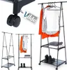 A collage of images showing a black metal garment rack with wheels and shelves, displaying clothes and accessories. Náhľad obrázku produktu