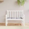 A white garden bench with a grey checkered cushion, placed against a light grey wall with a hanging plant. Produktbild-Vorschau