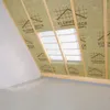 Interior of an attic space under construction, showing insulation and wooden beams. Produktbild-Vorschau
