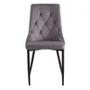 A single gray dining chair with a tufted back and black metal legs is shown against a white background. Náhľad obrázku produktu