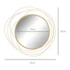 A round mirror with a gold wire frame is shown against a white background with dimensions indicated. Náhľad obrázku produktu