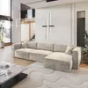 A modern living room with a large sectional sofa, coffee table, and abstract rug. Produktbild-Vorschau