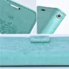 Collage of close-up shots of a green book-style phone case with embossed floral patterns. Náhled obrázku produktu