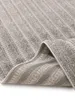 A close-up view of a gray rug with a striped pattern, showing the texture and weave. Anteprima dell’immagine prodotto