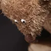 A close-up of a brown teddy bear's face. Podgląd zdjęcia produktu