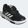A black Adidas sneaker with white stripes and velcro straps, shown on a white background. Podgląd zdjęcia produktu