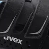 A close-up view of a black shoe with reflective silver accents and the 'uvex' logo. Anteprima dell’immagine prodotto