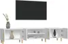 A white TV stand with a television mounted above it, and decorative items on the stand. Náhľad obrázku produktu
