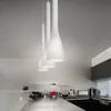 A modern kitchen with sleek countertops and cabinets, featuring three white pendant lights hanging from the ceiling. Náhľad obrázku produktu