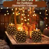 Christmas-themed table setting with pinecone-shaped LED candles and festive decorations. Produktbild-Vorschau
