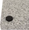 A close-up view of a pizza stone with a black knob on its surface. Podgląd zdjęcia produktu