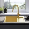 A modern kitchen sink with a gold faucet and sink, set against a window with a garden view. Produktbild-Vorschau