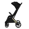 A side view of a black stroller on a white background. Produktbild-Vorschau