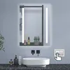 A modern bathroom vanity with a lit mirror, sink, and faucet.