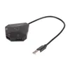 A black gaming adapter with a USB cable attached, shown against a white background. Podgląd zdjęcia produktu