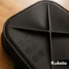 A close-up view of a black silicone baking mold with embossed symbols and text. Náhled obrázku produktu