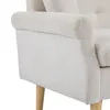 Close-up of the armrest and leg of a beige sofa. Anteprima dell’immagine prodotto