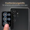A finger is shown applying a camera lens protector to a smartphone. Produktbild-Vorschau