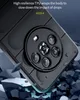 A close-up view of a dark blue phone case with a circular camera module, shown falling and surrounded by debris, illustrating its drop protection. Produktbild-Vorschau