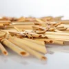 A close-up shot of a straw star decoration, with many such decorations arranged in a pattern. Produktbild-Vorschau