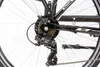 A close-up view of the rear derailleur and cassette gears of a bicycle. Produktbild-Vorschau