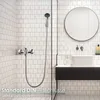 A bathroom scene with a shower fixture and sink. Produktbild-Vorschau