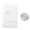 A white fabric item with a zipper, folded, next to a roll of silver hook-and-loop fastener on a white background. Produktbild-Vorschau