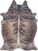 A cowhide rug with a brindle pattern.