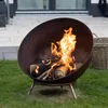 A fire pit with burning logs sits on a grassy lawn. Produktbild-Vorschau