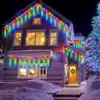 A house decorated with colorful LED icicle lights for Christmas. Náhled obrázku produktu