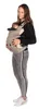 A woman is holding a baby in a carrier. Náhľad obrázku produktu
