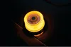 A close-up shot of a yellow OSRAM LED work light on a dark surface. Produktbild-Vorschau