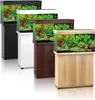 Four aquariums with stands are displayed in a row, each with a different colored stand and lid. Podgląd zdjęcia produktu