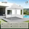 A white gazebo is set up on a patio next to a swimming pool, with a house and a scenic landscape in the background. Produktbild-Vorschau