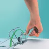 A hand is shown operating the rings of a binder. Produktbild-Vorschau