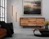 A modern living room with a sideboard, sofa, coffee table, and abstract art. Anteprima dell’immagine prodotto