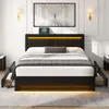 A black upholstered bed frame with integrated LED lighting and storage drawers, set in a bedroom environment. Podgląd zdjęcia produktu