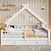 A white house-shaped daybed with storage drawers and shelves, decorated with string lights. Produktbild-Vorschau