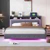 A modern bedroom with a bed featuring a headboard with storage and LED lighting. Podgląd zdjęcia produktu